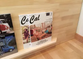Spandrel wall magazine stand up