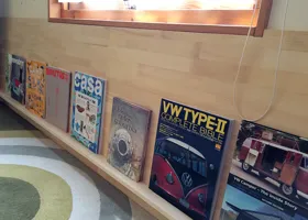 Spandrel wall magazine stand end